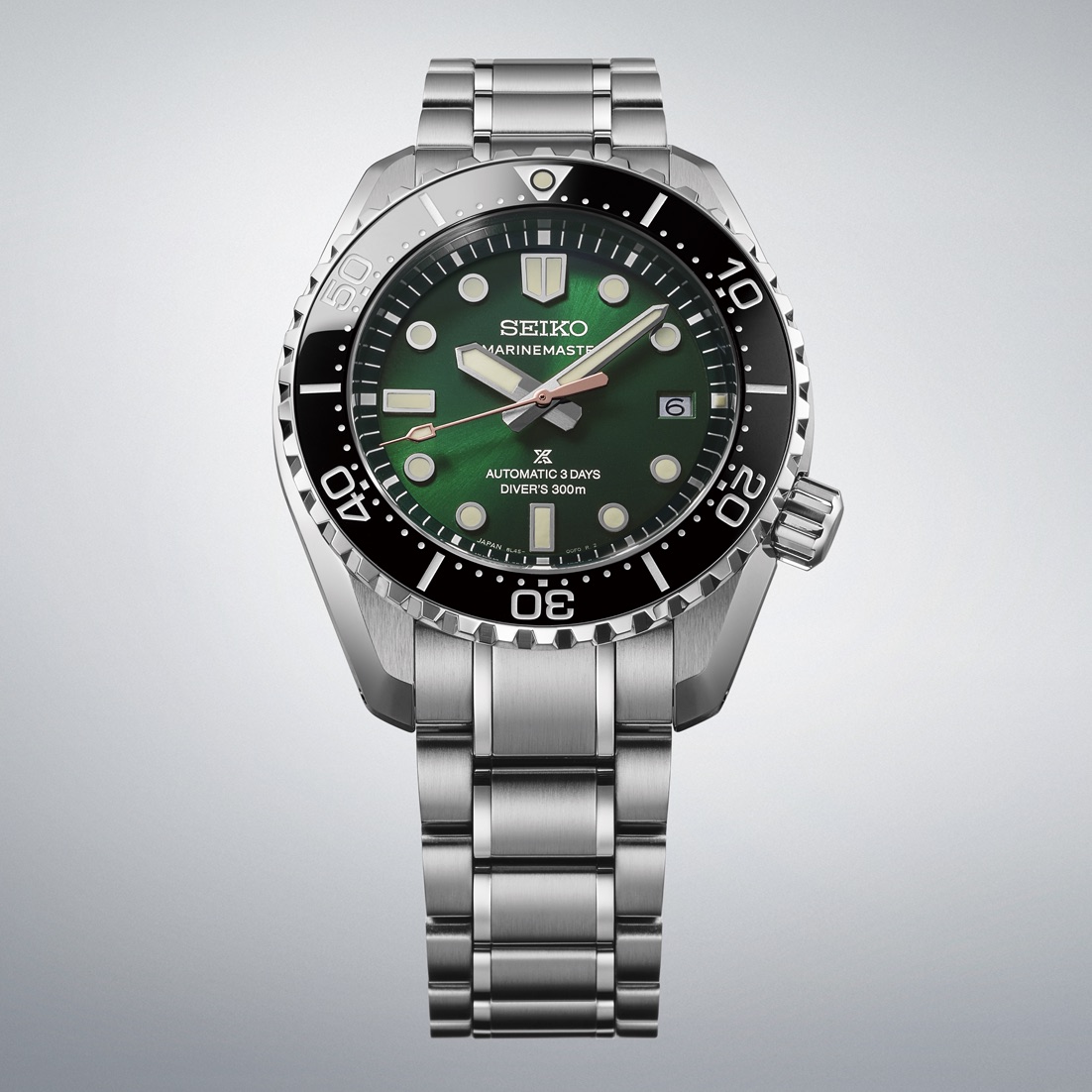 Front view of the green dial and steel bracelet