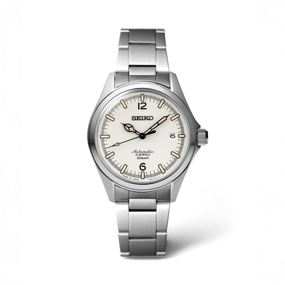 Straight-on view of the off-white dial, Arabic12and6, and steel bracelet