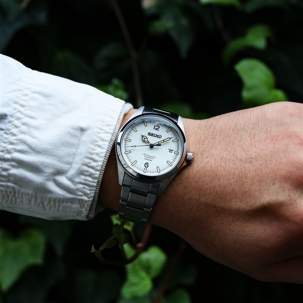 Official wrist photograph showing the HZB002J worn with a white shirt